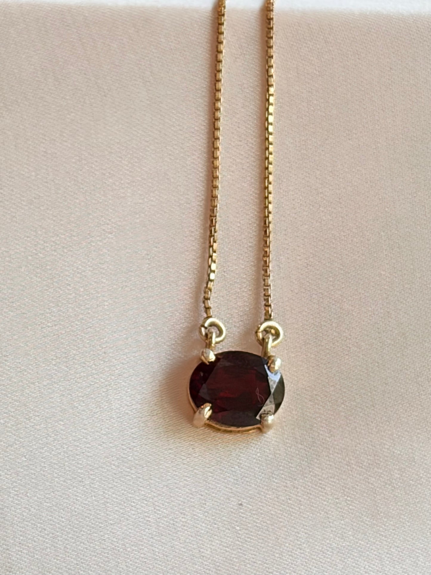 All Eyes On me Garnet Oval Pendant.